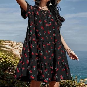 New, never worn cherry print smock dress with ruffle sleeves and bottom